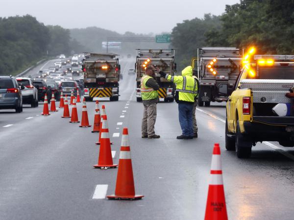 Traffic on Interstate 95 was diverted for hours after a group of armed men fled from police near Wakefield, Mass. on Saturday. Massachusetts state police say 11 suspects have been taken into custody.