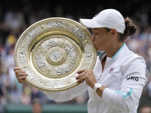 Australia's Ashleigh Barty poses with the winner's trophy on Saturday after winning the Wimbledon women's singles final against the Czech Republic's Karolina Pliskova.
