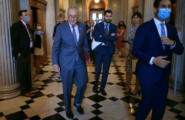 Senate Majority Leader Chuck Schumer, D-N.Y., walks off the Senate floor Wednesday during a procedural vote on the bipartisan infrastructure bill that ultimately failed.