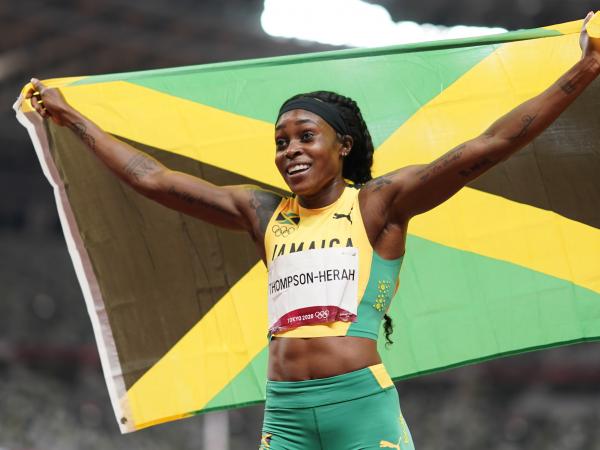 Elaine Thompson-Herah, of Jamaica, reacts after winning the final of the women's 200-meters at the 2020 Summer Olympics, Tuesday, Aug. 3, 2021, in Tokyo.