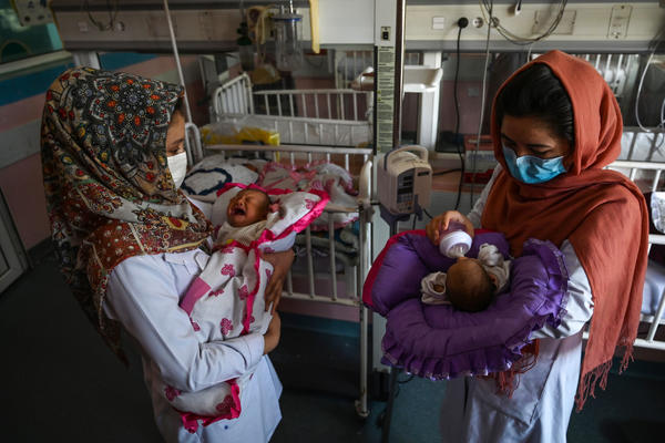 Nurses feed newborn babies rescued and brought to Ataturk National Children's Hospital in Kabul, Afghanistan, on May 15, 2020, after their mothers were killed in an attack on a maternity ward operated by Doctors Without Borders. The health-care nonprofit runs clinics and hospitals in various parts of the country.