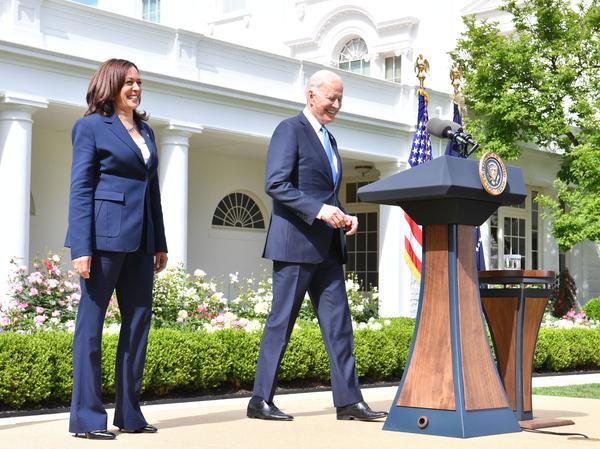 President Biden arrives with Vice President Harris to discuss the CDC's new mask guidance in the Rose Garden of the White House on Thursday.