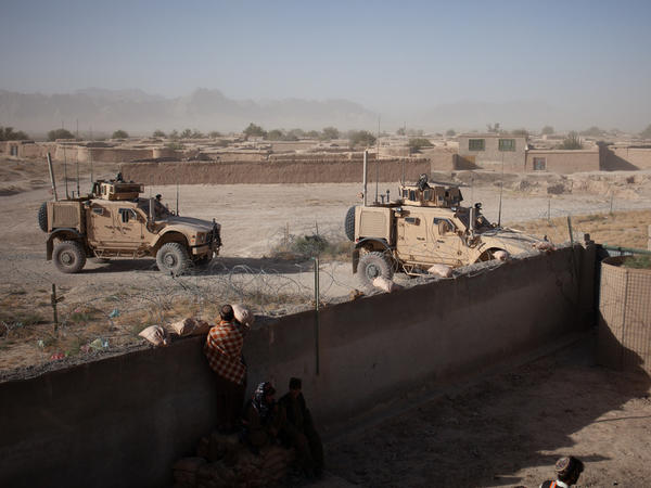 U.S. soldiers enter a compound for a security meeting in Shah Joy District, Zabul Province, Afghanistan in the fall of 2010.