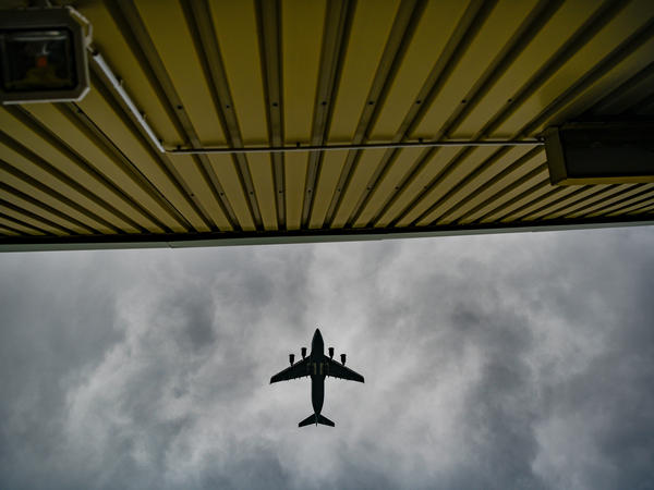 A plane flies over temporary camp for refugees from Afghanistan at the U.S. Army's Rhine Ordnance Barracks (ROB), where they are being temporarily housed, on August 30, 2021 in Kaiserslautern, Germany.
