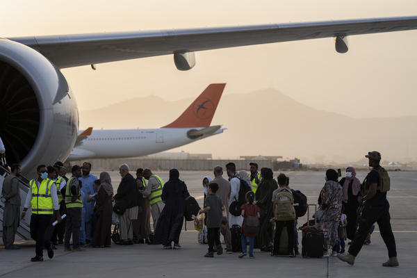Passengers board a Qatar Airways aircraft at the airport in Kabul, Afghanistan on Thursday.