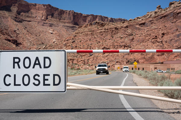 The gate to Arches National Park is closed on a weekday morning last month, as it is many mornings after the parking lots and trails quickly fill up.