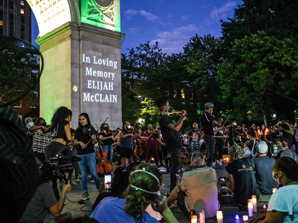 String players perform during a violin vigil for Elijah McClain in Washington Square Park on June 29, 2020, in New York City.