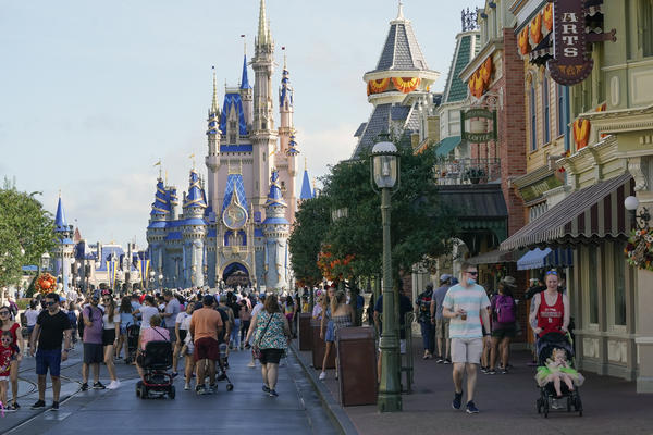 Guests stroll along Main Street at the Magic Kingdom theme park at Walt Disney World. The park celebrates its 50th anniversary on Oct. 1, 2021.
