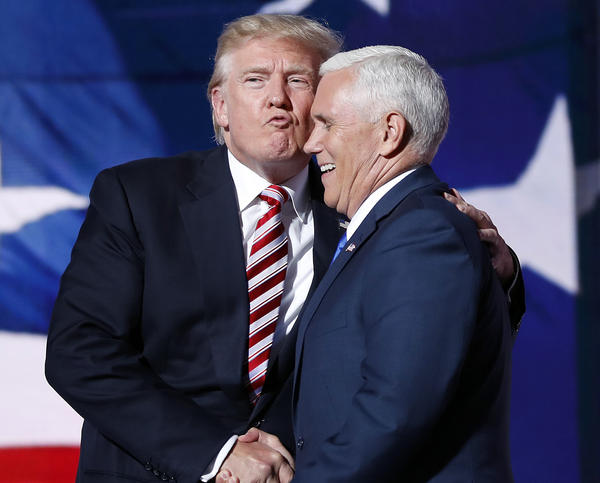 Donald Trump and his then-running mate, Mike Pence, embrace as they shake hands after Pence's acceptance speech at the 2016 Republican National Convention in Cleveland.
