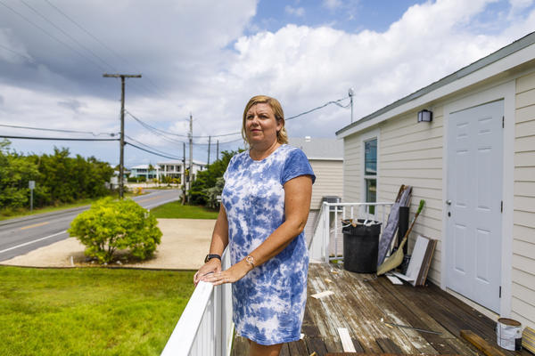 When buying her new home in Big Pine Key, Fla., Amy Tripp closed early, just before federal flood insurance rates rose by thousands of dollars. Her rate will still go up more slowly over time.