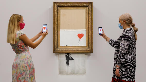 Banksy's "Love is in the Bin" (2018) is installed at Sotheby's on Sept. 3, in London. On Thursday it was auctioned for $25.4 million, a record for the artist.