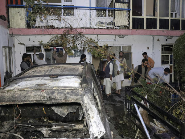 Afghans inspect damage of the Ahmadi family house after a U.S. drone strike in Kabul, Afghanistan, on Aug. 29. The strike, which the Pentagon originally deemed a success in striking an ISIS-K target, killed 10 civilians, none of whom were associated with the terrorist group.