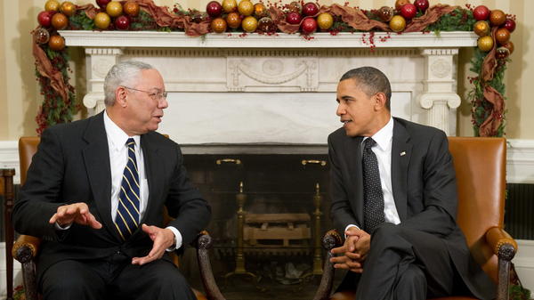 President Barack Obama speaks with former Secretary of State Colin Powell in the Oval Office on Dec. 1, 2010. Powell, who had broken his longtime Republican ties to endorse Obama in 2008, died Monday.
