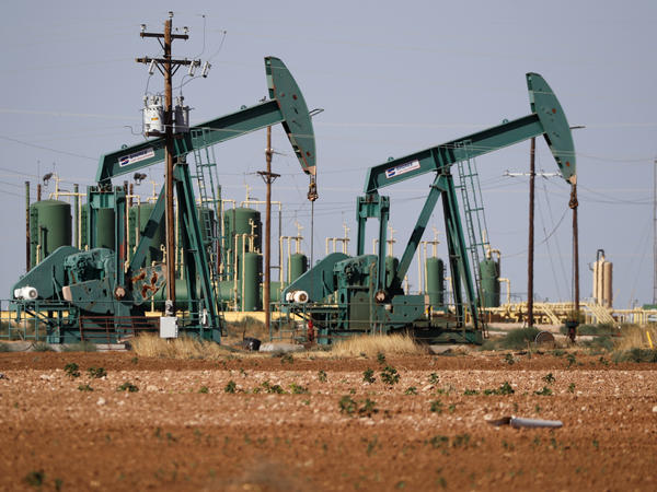 In this July 29, 2020 file photo, a view of a pump jack operating in an oil field in Midland, Texas.