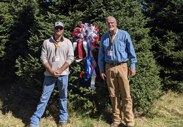  Beau Estes, left, with his father Rusty Estes with the soon-to-be 2021 White House Christmas Tree on Oct. 20, 2021.