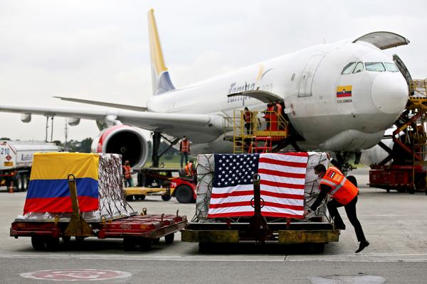 Containers of Moderna COVID-19 vaccine doses, donated by the United States, arrive in Bogota, Colombia, in July. The U.S. plans to send more than a billion vaccines abroad by September 2022.