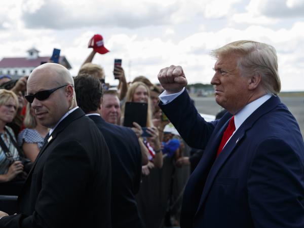 President Trump greets supporters after arriving at Florida's Ocala International Airport on Thursday to give a speech on health care at The Villages retirement community. In his speech, Trump gave seniors a pep talk about what he wants to do for Medicare, contrasting it with plans of his Democratic rivals.