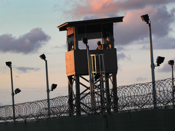 A U.S. military guard tower stands on the perimeter of the detainee camp on September 16, 2010, in Guantánamo Bay, Cuba. There are now 39 detainees remaining after the prisoner transfer on July 19, 2021.