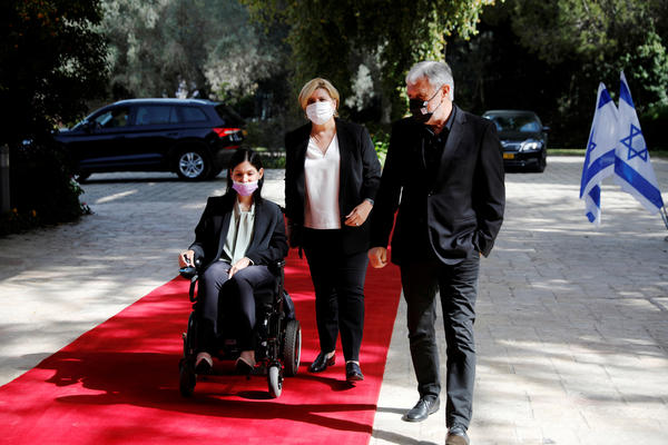 Karine Elharrar, Orna Barbivai and Meir Cohen from the Yesh Atid party arrive for consultations on the formation of a coalition government in Jerusalem on April 5, 2021.