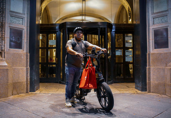 Gustavo Ajche delivers food for DoorDash in Lower Manhattan. Ajche, who has helped organized 3,000 other food delivery workers during the pandemic, was one of the activists who helped get legislation passed to improve working conditions and pay for the couriers, October 15, 2021.
