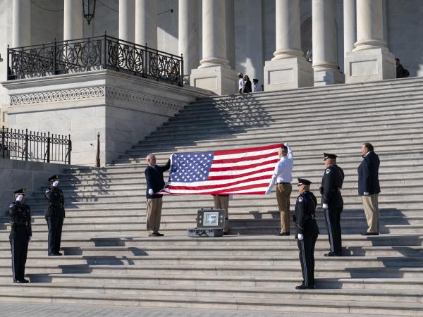 To observe the 100th anniversary of the Tomb of the Unknown Soldier, former sentinels are joined by the Ceremonial Unit of the U.S. Capitol Police for a flag folding observance at the Capitol in Washington on Wednesday. The special flag was flown over several American military cemeteries at World War I battle sites in France.