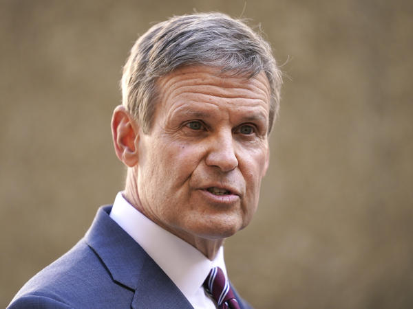 Tennessee Gov. Bill Lee speaks to reporters Tuesday, Jan. 19, 2021, in Nashville, Tenn. He released a video on Wednesday inviting law enforcement officers from across the country to join the Tennessee Highway Patrol.