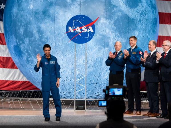 NASA astronaut Jessica Watkins waves at the audience during the astronaut graduation ceremony at Johnson Space Center in Houston, Texas, in January 2020. In April 2022, she will become the first Black woman to live and work on the International Space Station.