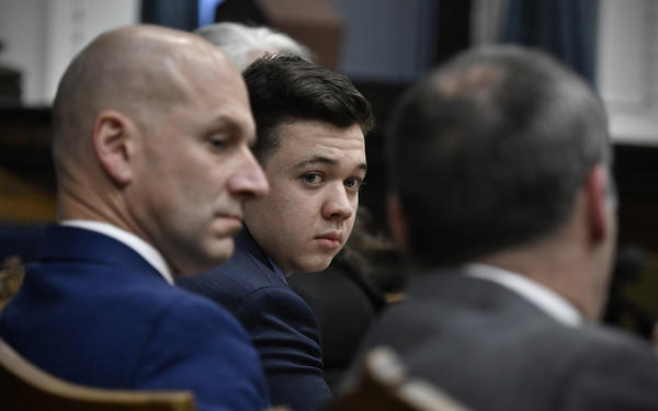 Kyle Rittenhouse (center) looks over to his attorneys as the jury is dismissed for the day on Thursday during his trial at the Kenosha County Courthouse in Kenosha, Wisconsin.