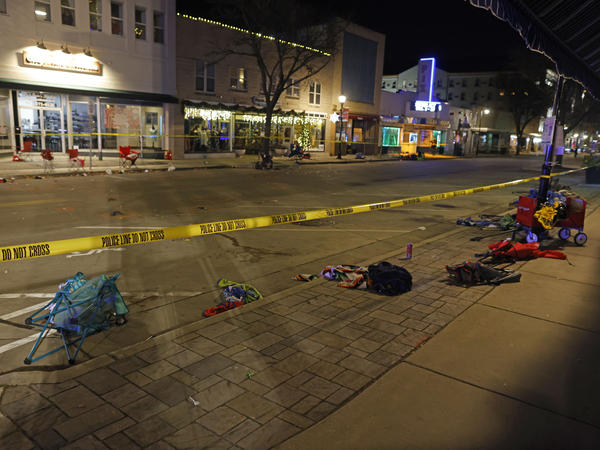 Police tape cordons off a street in Waukesha, Wis., after an SUV plowed into a Christmas parade, hitting multiple people on Sunday.