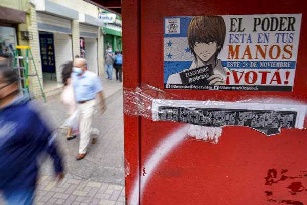 A sticker on a wall in Tegucigalpa, the Honduran capital, invites people to vote in the presidential elections on Sunday. Hondurans will elect a successor to President Juan Orlando Hernandez, who was first elected in 2013.