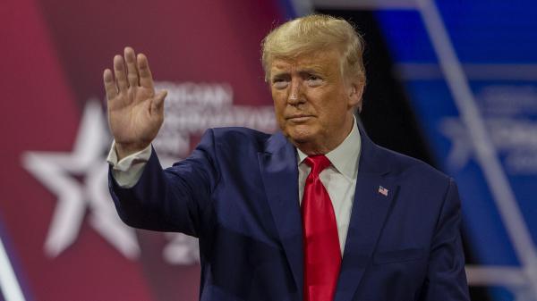Then-President Donald Trump waves at the crowd during the 2020 Conservative Political Action Conference. This year, Trump is out of office but is still headlining the event.