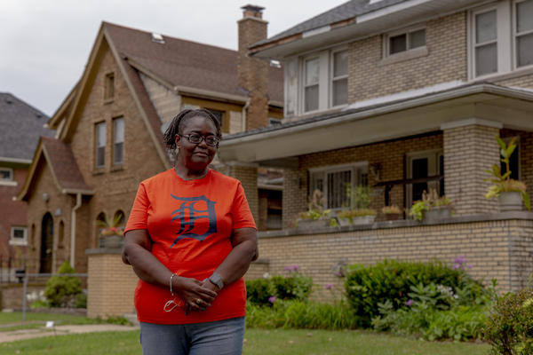 Theresa Bonham stands in front of her home in the Jefferson Chalmers neighborhood in Detroit. A storm on June 26 caused extreme flooding resulting in extensive water damage to Bonham's basement.