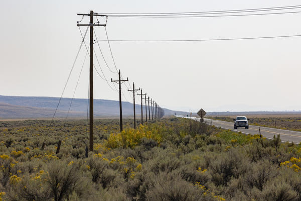 The Duck Valley Indian Reservation is home to the Shoshone-Paiute Tribes and comprises about 450 square miles along the Idaho/Nevada border. Only one power line goes into it, shown here along Highway 51.