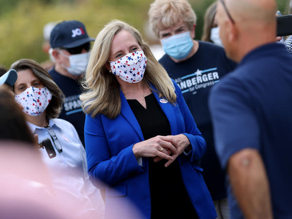 Rep. Abigail Spanberger, D-Va., is one of 70 House Democrats that Republicans are targeting to beat in November 2022. Here she greets voters outside the Orange County Registrar's office Sept. 18, 2020 in Orange, Va.