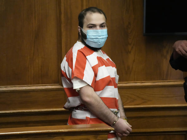 Ahmad Al Aliwi Alissa, accused of killing 10 people at a Colorado supermarket in March, is led into a courtroom for a hearing on Sept. 7, in Boulder, Colo.