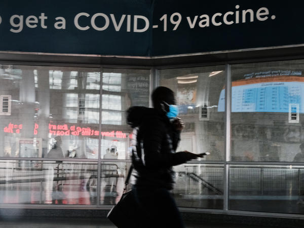 A sign urges people to get the Covid vaccine at the Staten Island Ferry terminal on November 29, 2021 in New York City.