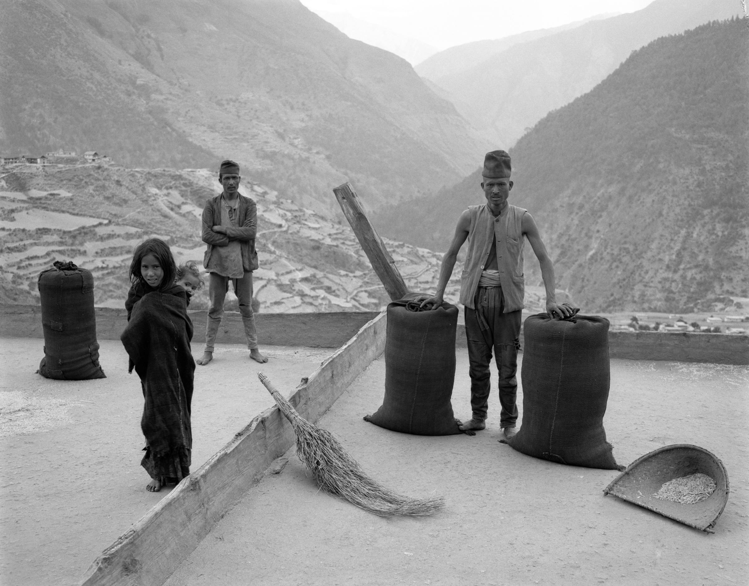 the villagers of karkibada take to the rooftops to thresh and