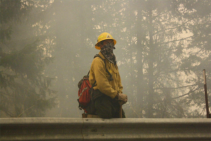 firefighters washington twisp river wildfire mild offense conditions state okanogan complex contained nearly fire officials danger warn despite continues rain