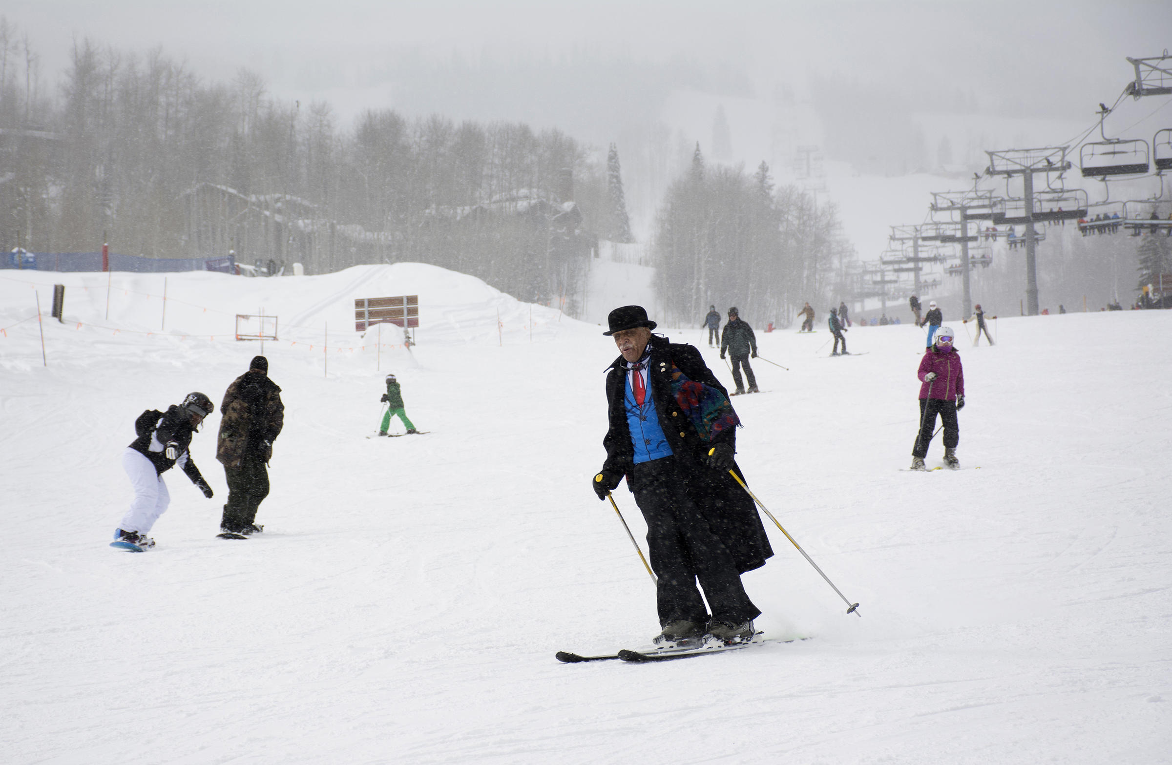 Art Clay, 78, of Chicago takes a run in a light snowfall on Wednesday. Clay is a co-founder of the National Brotherhood of Skiers.