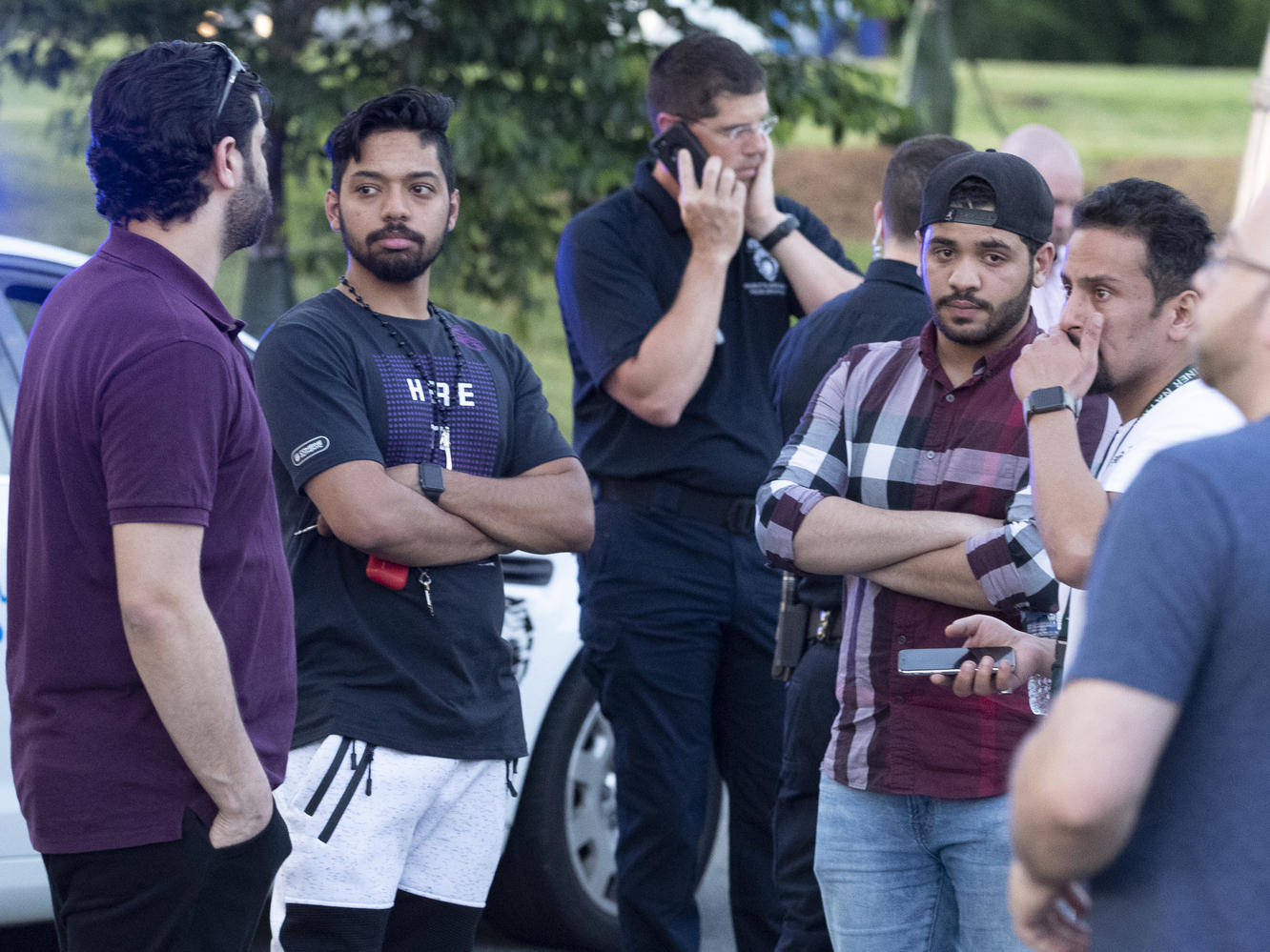 people gather across from the campus of the university of north