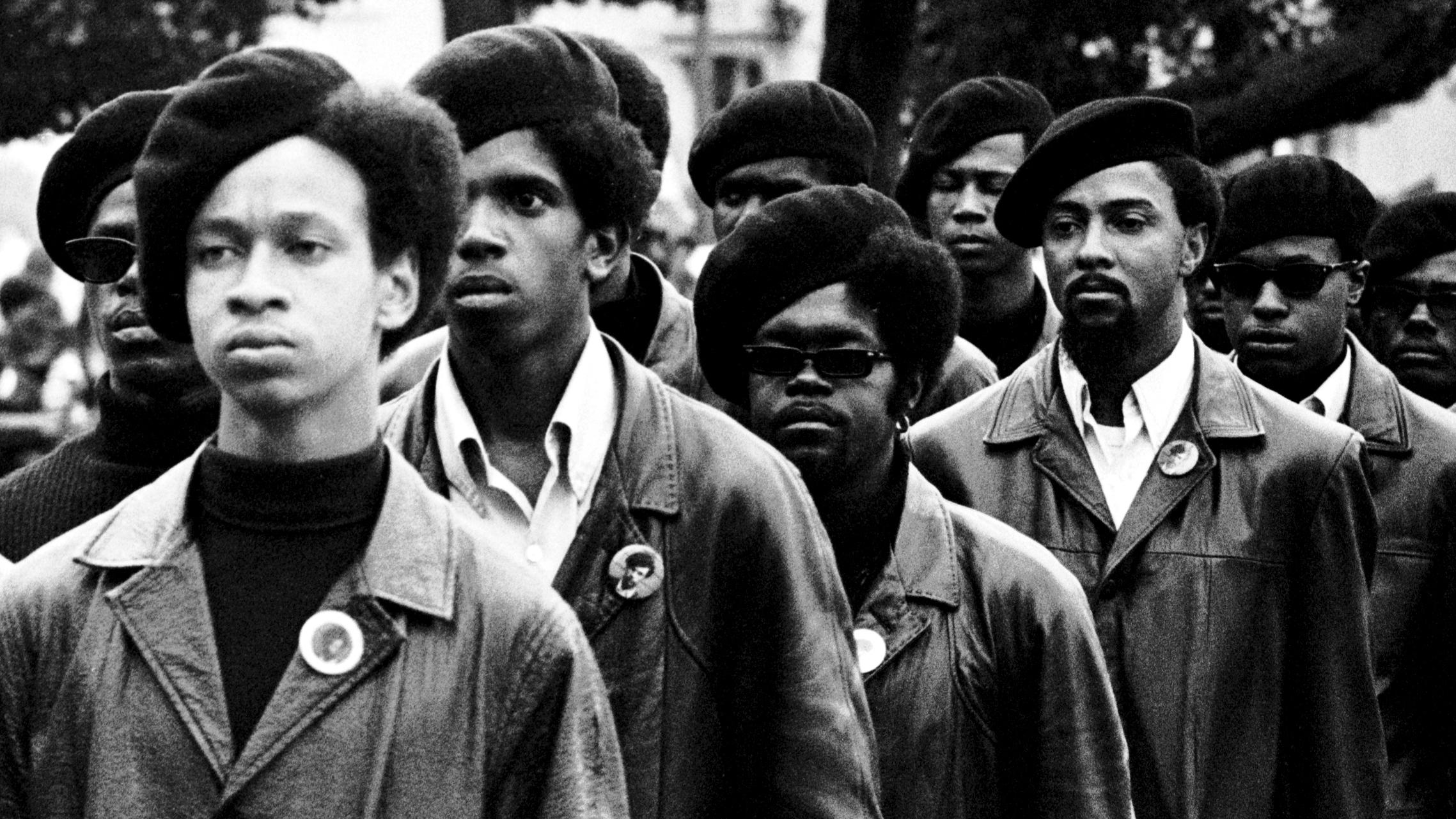 Members of the Black Panthers line up at a rally at DeFremery Park in Oakland Calif