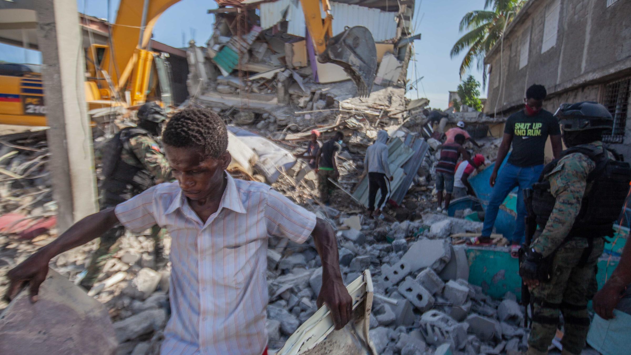 In QuakeRavaged Haiti, Rescuers Scramble To Save People Trapped In