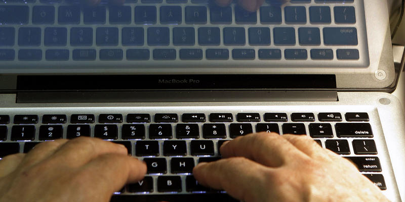 In this Feb. 27, 2013, file photo, hands type on a computer keyboard in Los Angeles.