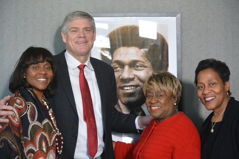 Public Broadcasting Atlanta CEO Wonya Lucas (left), Bill Lucas's wife Rubye (center right) and Daughter Andrea Lucas (right) pose with Braves alumnus Dale Murphy in front of a picture of Bill Lucas.