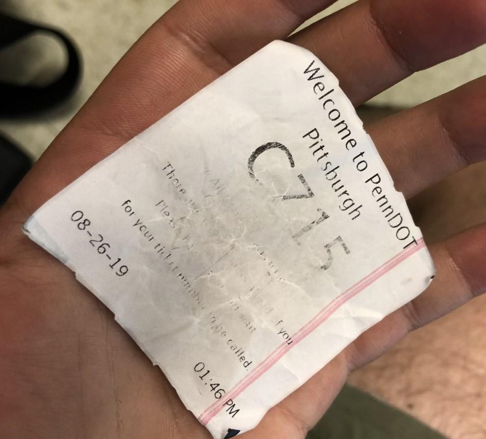 Alex Herisko was handed ticket C715 when they arrived at the PennDOT Driver License center on Monday, August 26, 2019. (Katie Blackley/WESA)