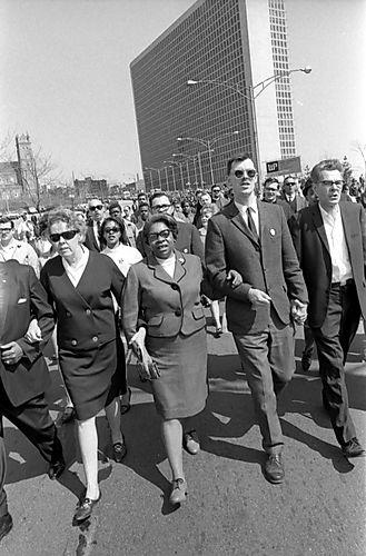 Marchers walk arm in arm down Centre Avenue near the Civic Arena in the Hill District toward Downtown and the Point on April 7, 1968. (Charles R. Martin Photographs/University of Pittsburgh)