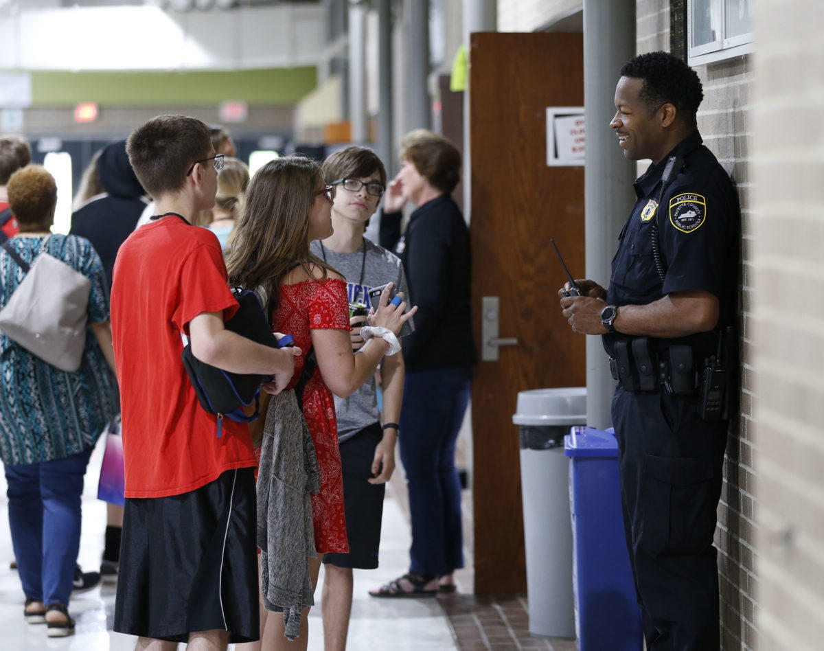 Public officer. School Police. Paul Laurence Dunbar High School. Police Officers at School.