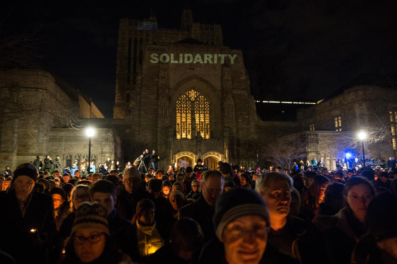 Outside of the Sterling Memorial Library, hundreds gathered, candles in- hand, to support refugees and immigrants. 