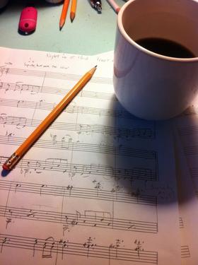 Good (My idea of good is a bit introverted.) lighting, a sharp no. 2 pencil, good coffee and manuscript are the tools of the "bliss station" or what I call my small, cluttered, chaotic desk where I write music.